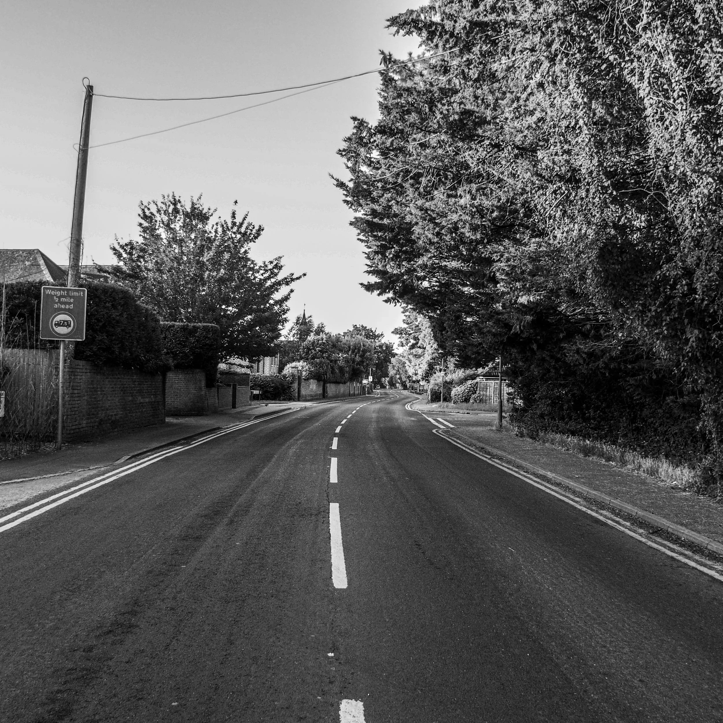Black and white photograph of a road in Bourne End, Buckinghamshire