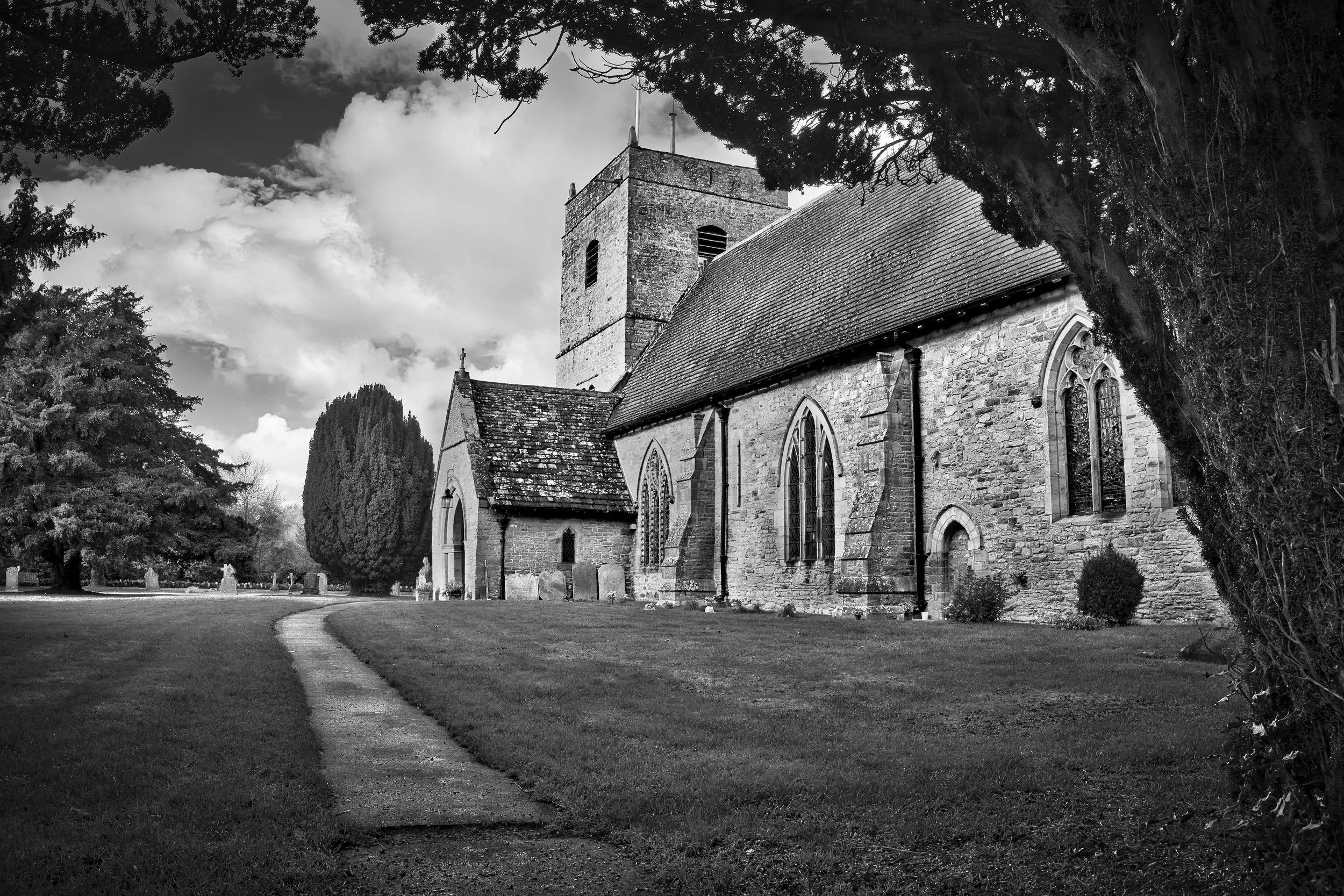 Historic stone church photographed in black and white