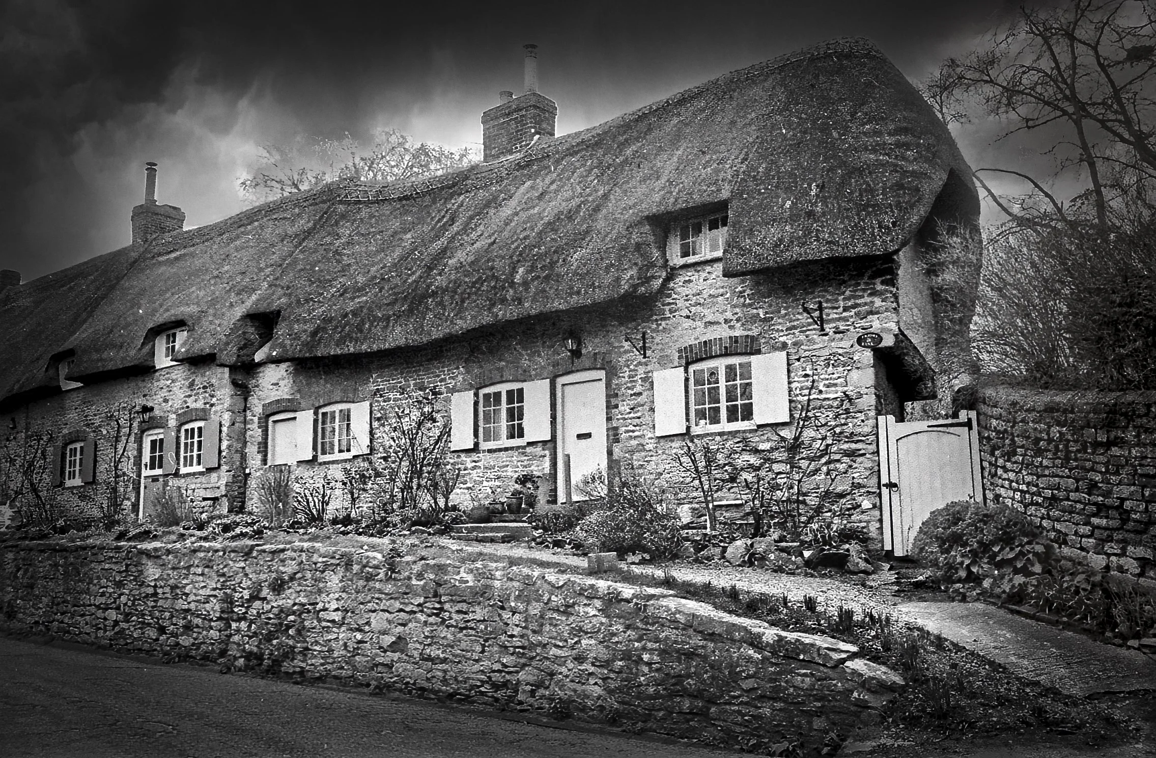 Traditional thatched cottage photographed in black and white