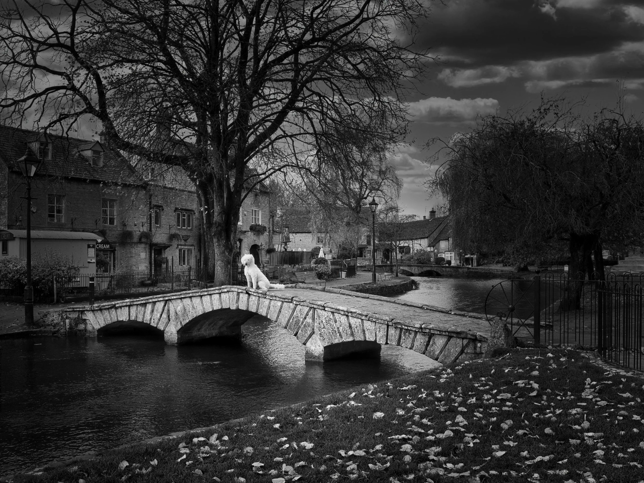 Elvis sitting on a bridge in Bourton-on-the-Water