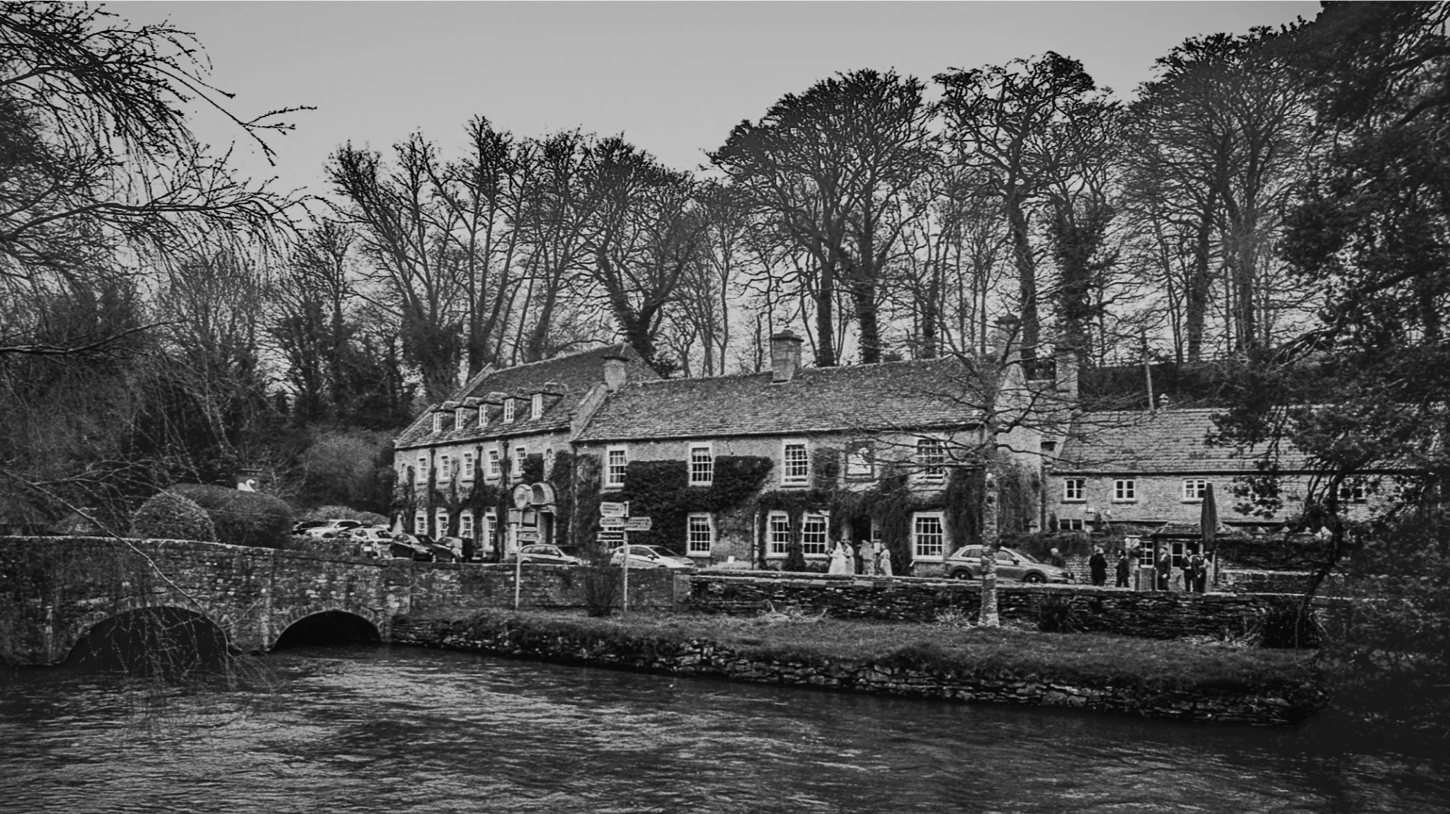 Wedding scene beside the river at Bibury