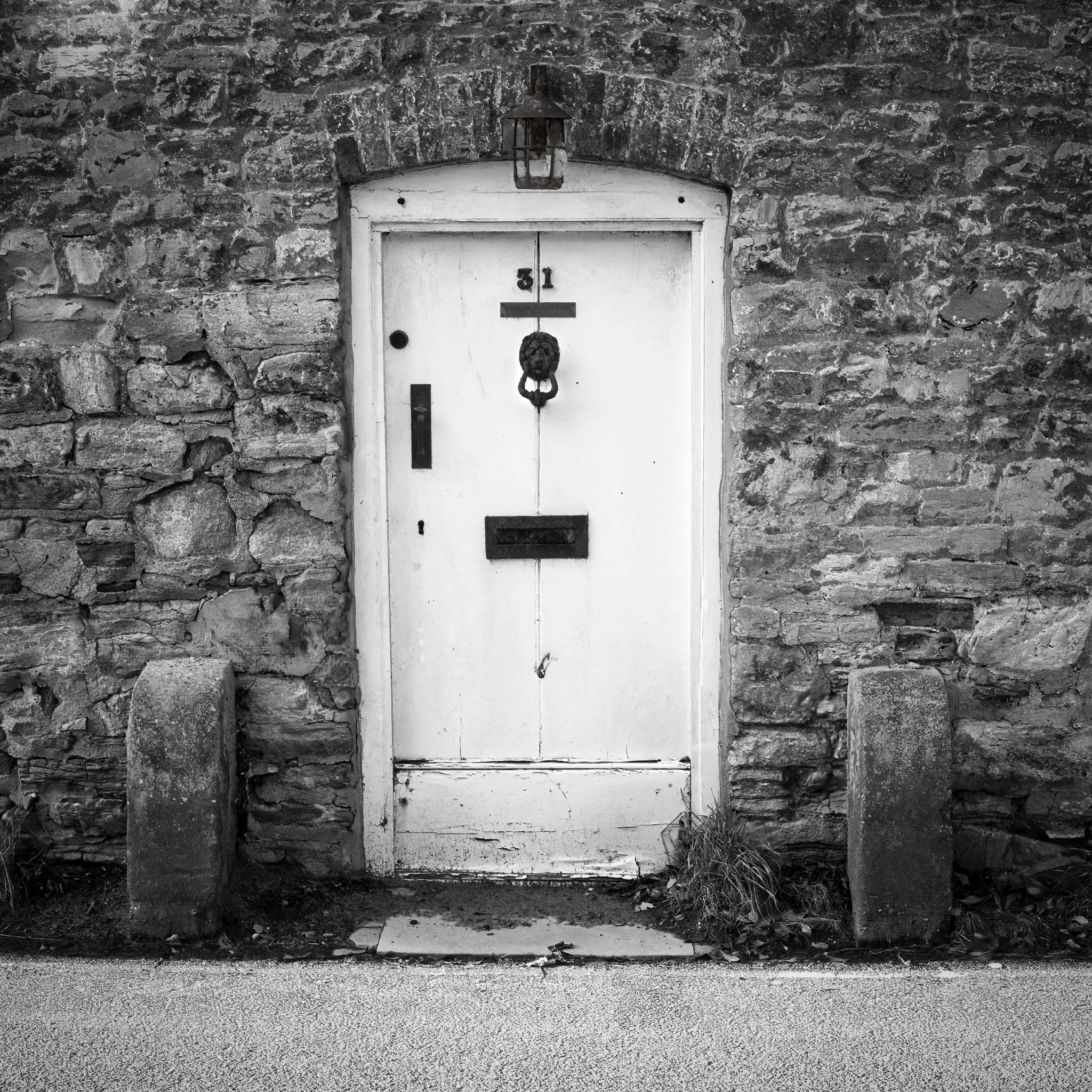 Old cottage door set into a stone wall