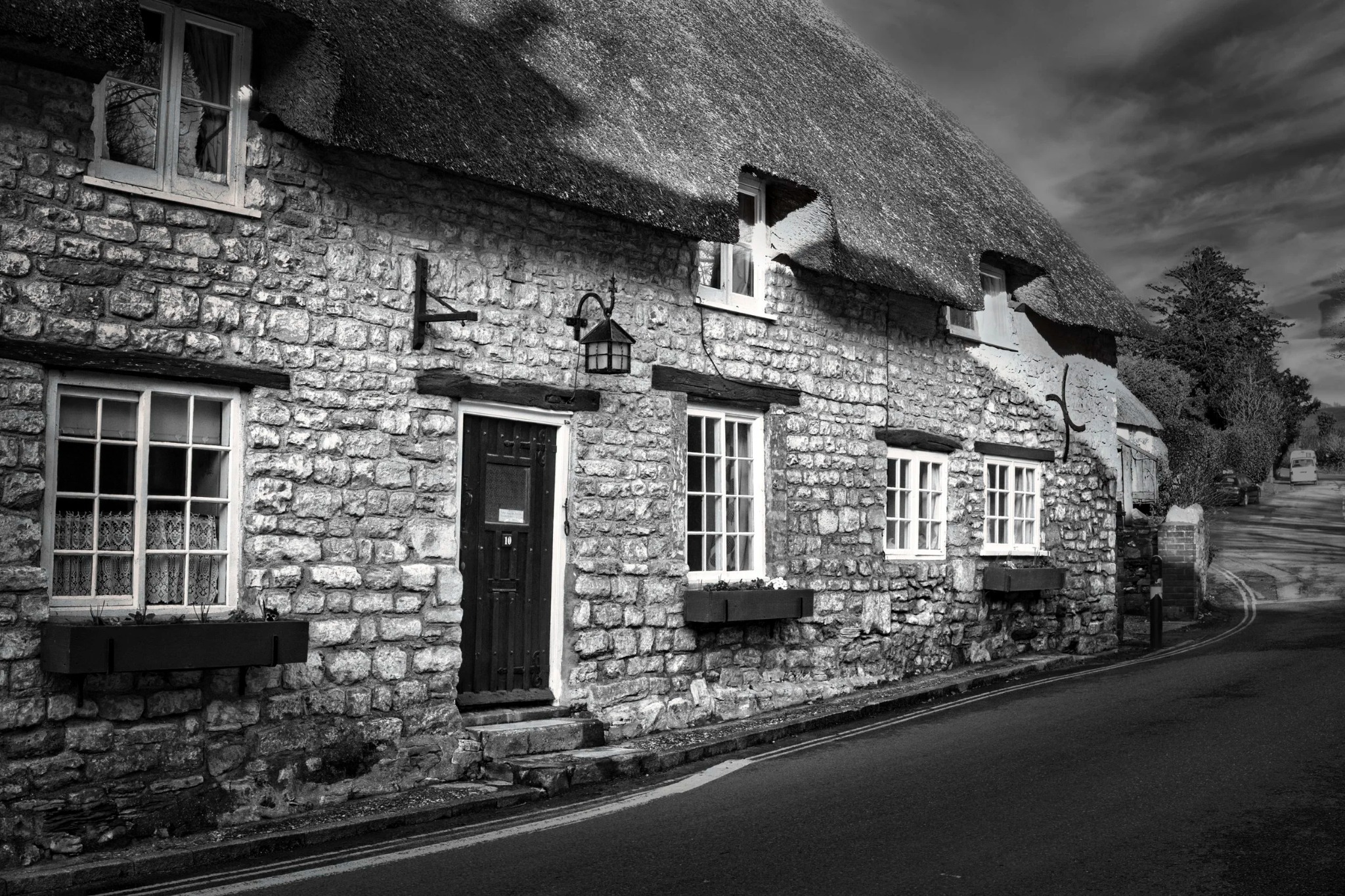 Village cottages beneath an evening sky