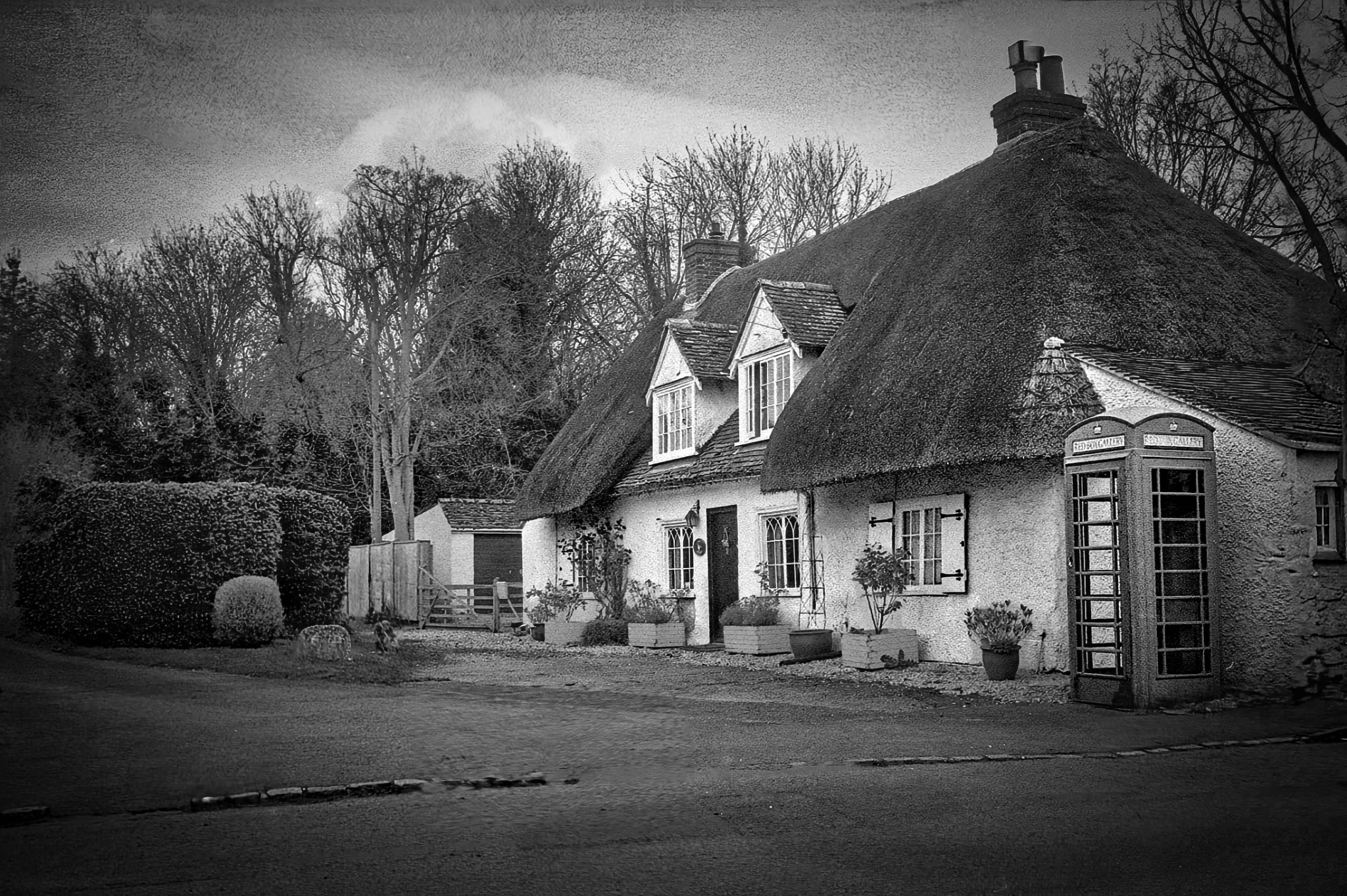 Thatched cottages and traditional red telephone boxes