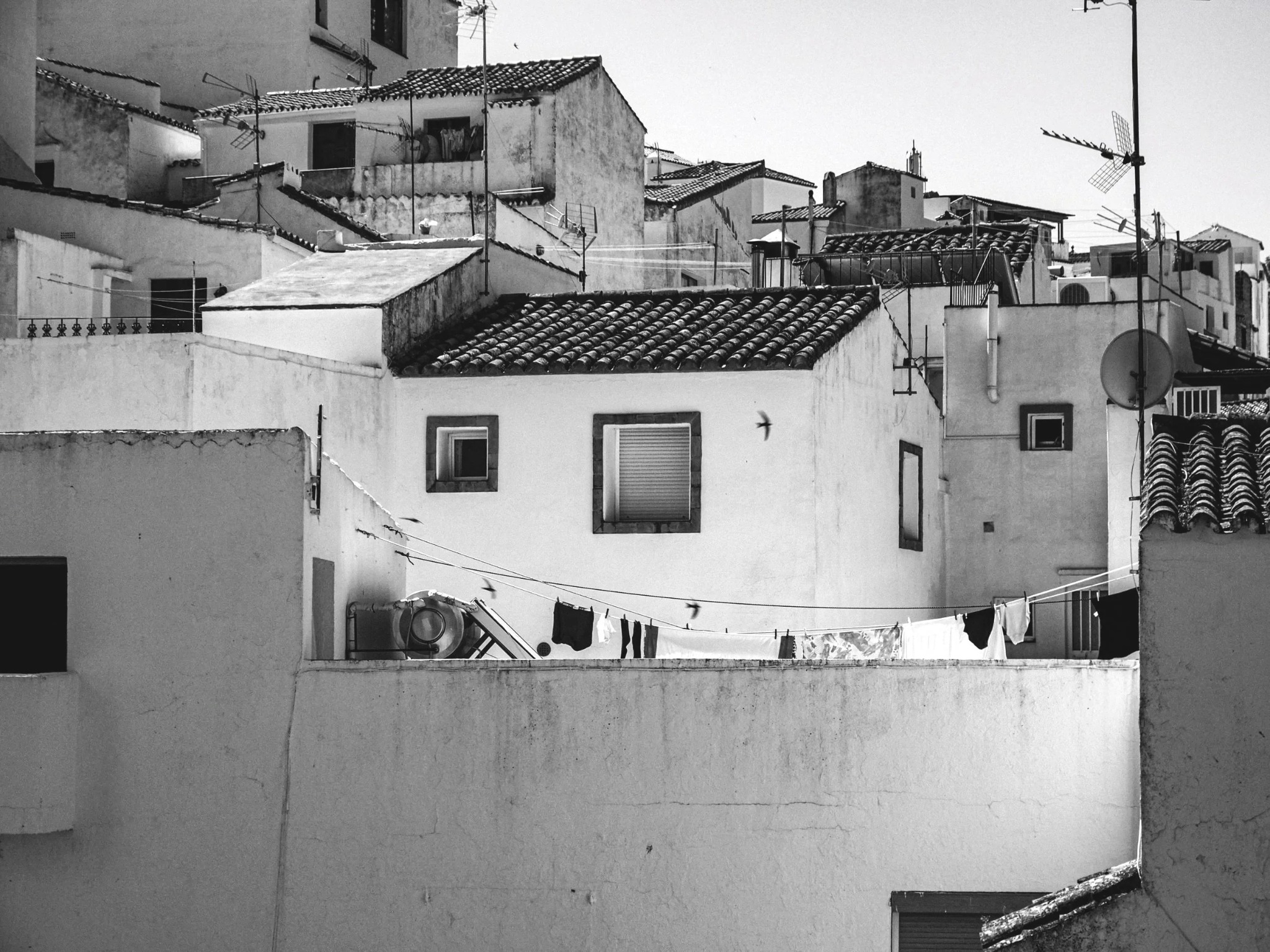 Casares rooftops washing line andalusia black and white