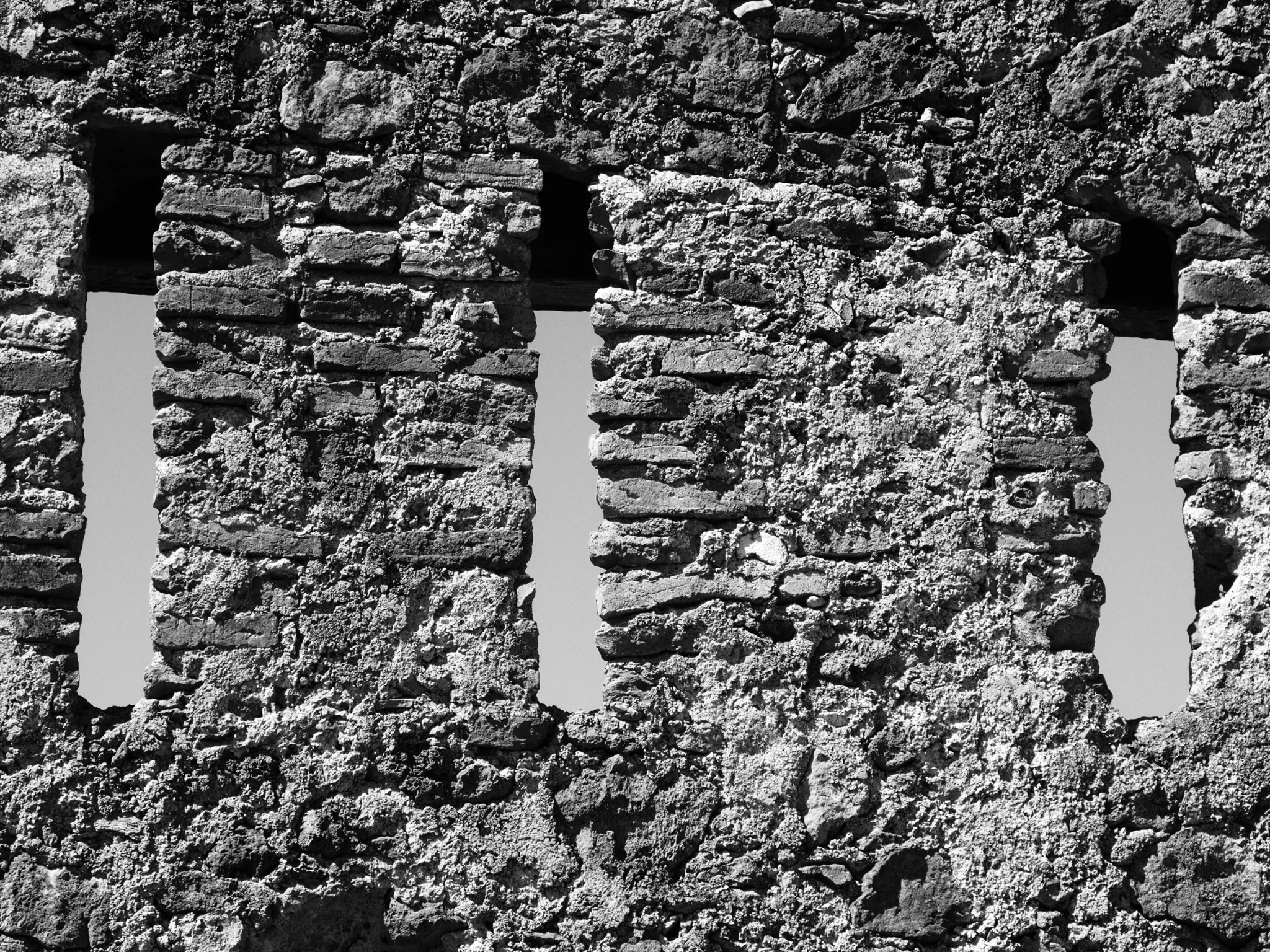 Castle battlements arrow slits ancient stone sky andalusia