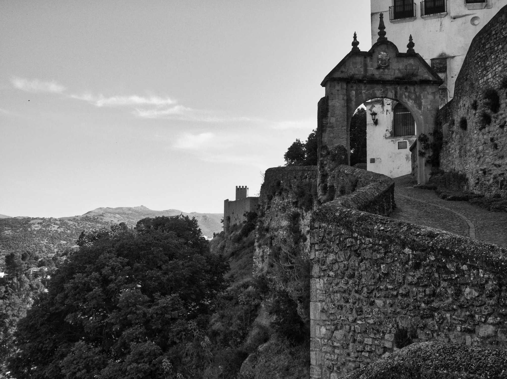 Ronda city wall gateway arch battlements andalusia