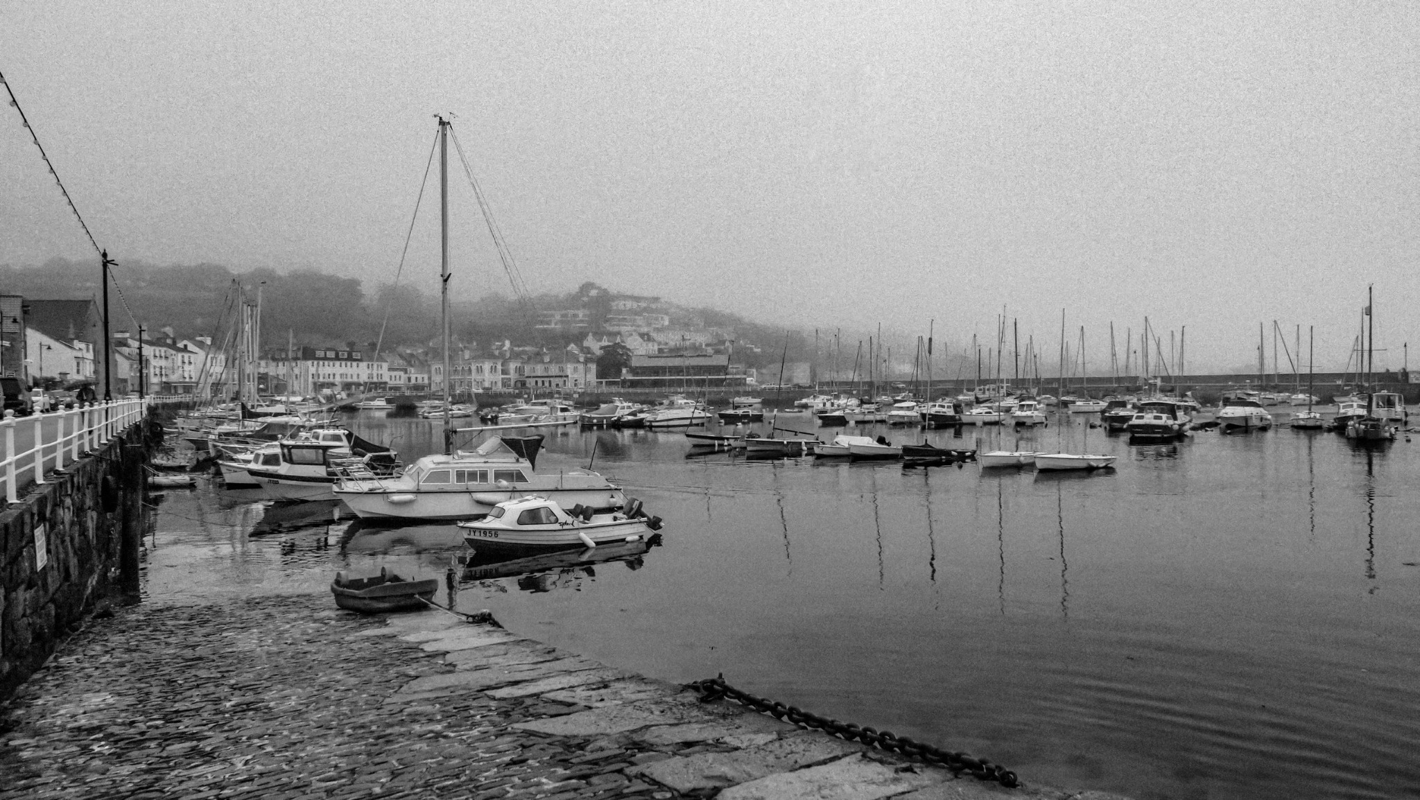 Misty Jersey harbour and cobbles