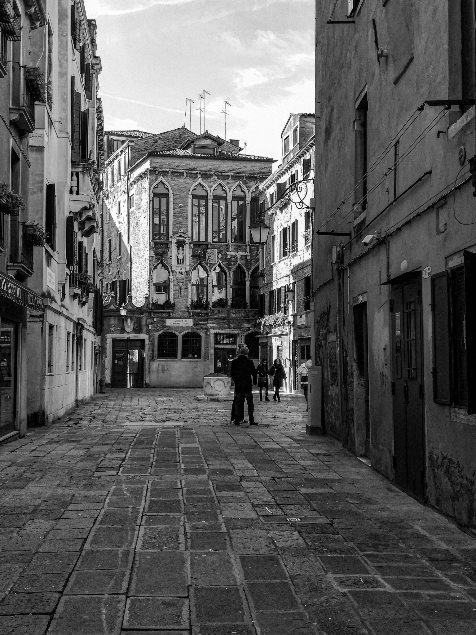 Venice backstreet figures black and white