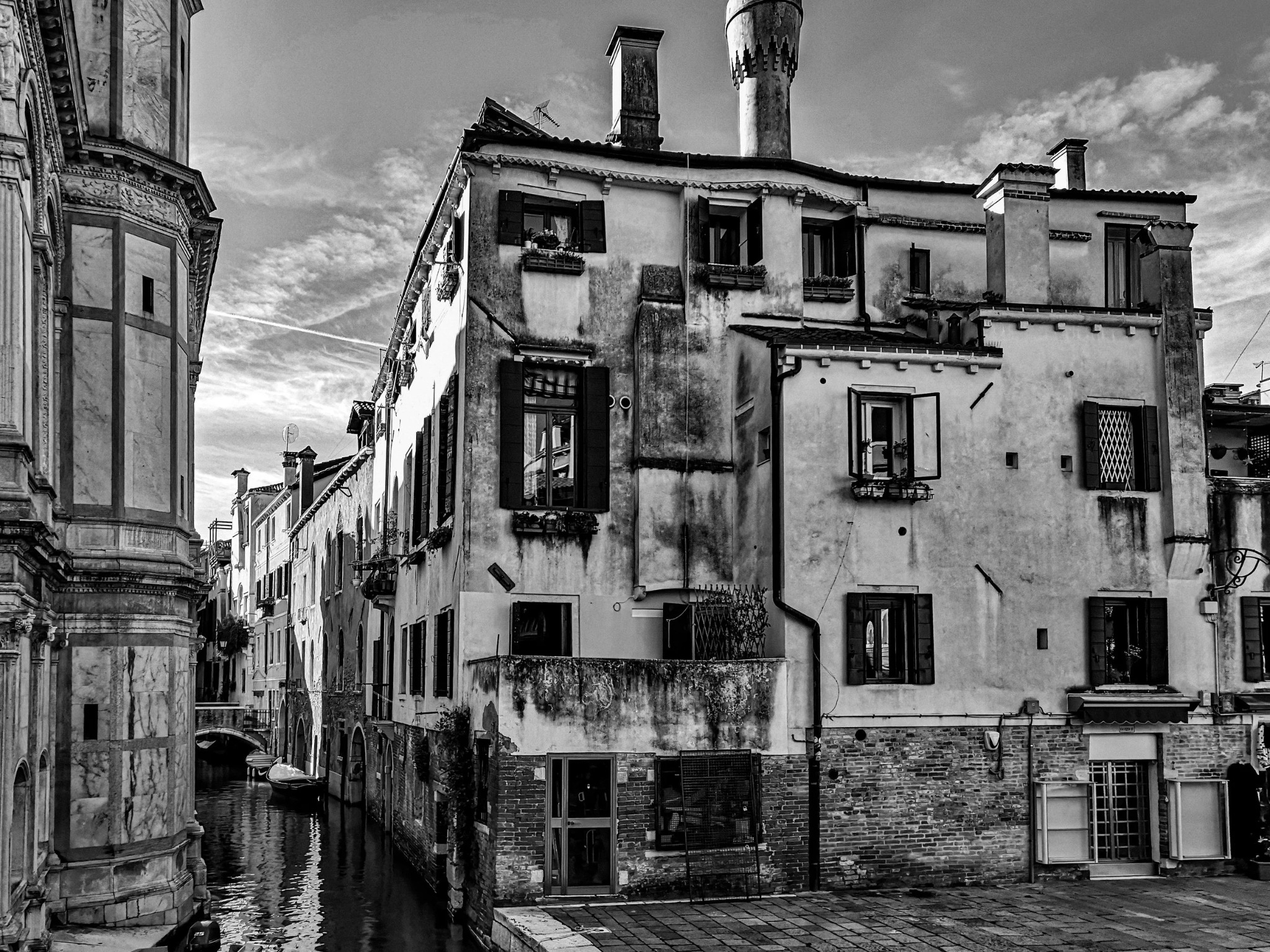 Venice canal weathered building black and white