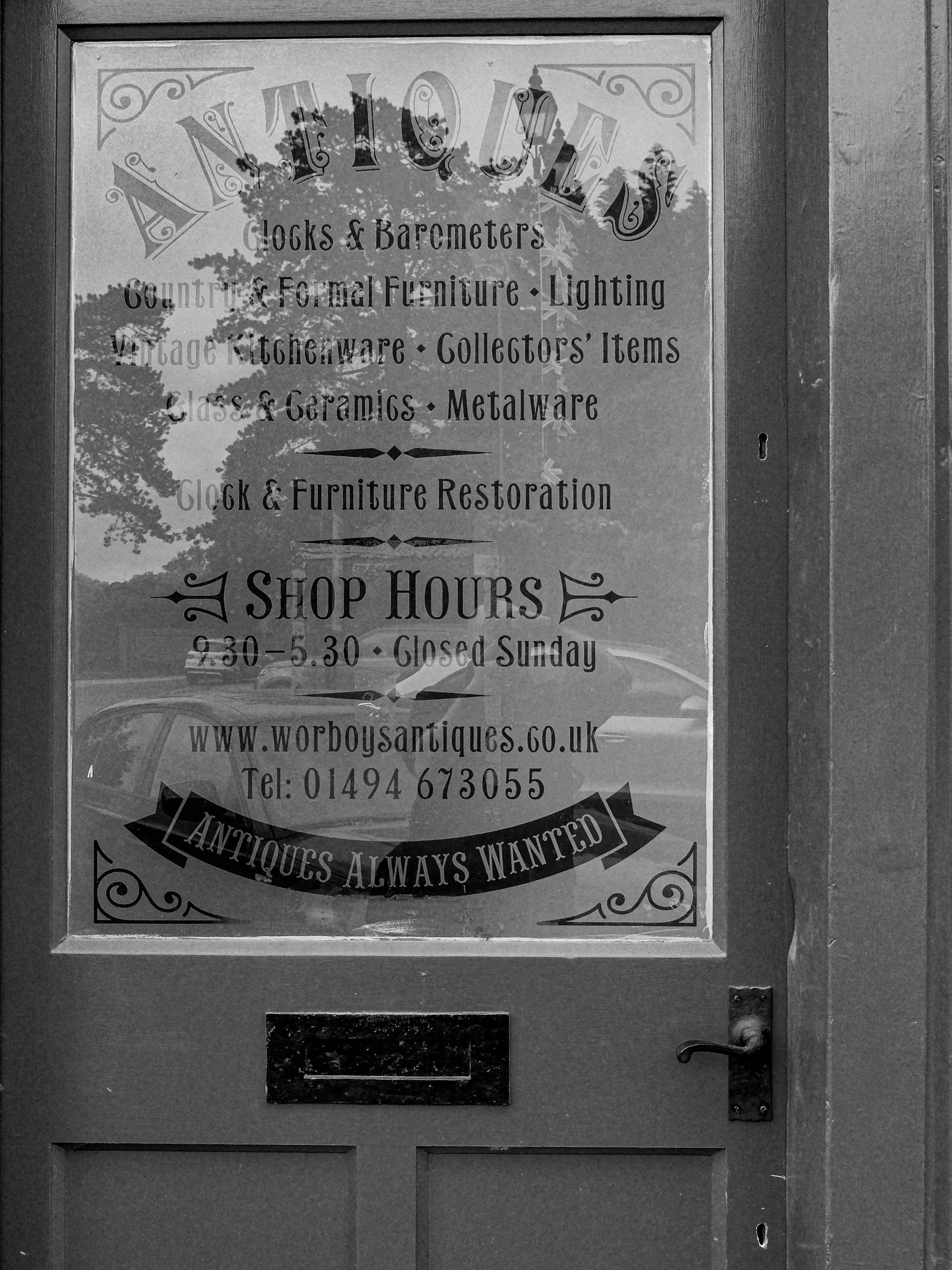 Antiques shop door with reflections