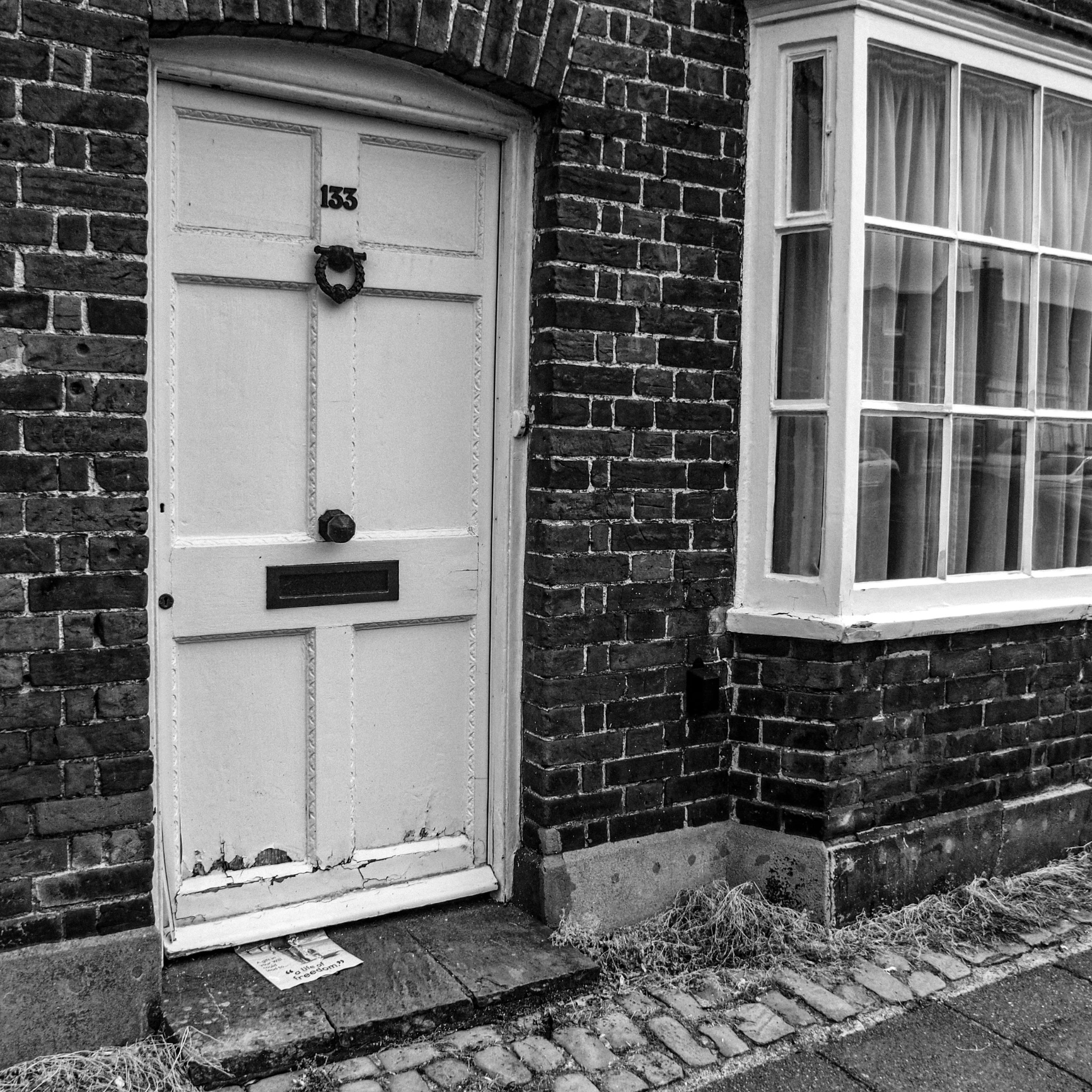 Weathered front door number 133